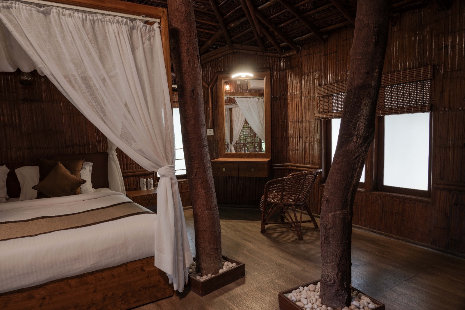Bedroom interior with living tree-trunk pillars