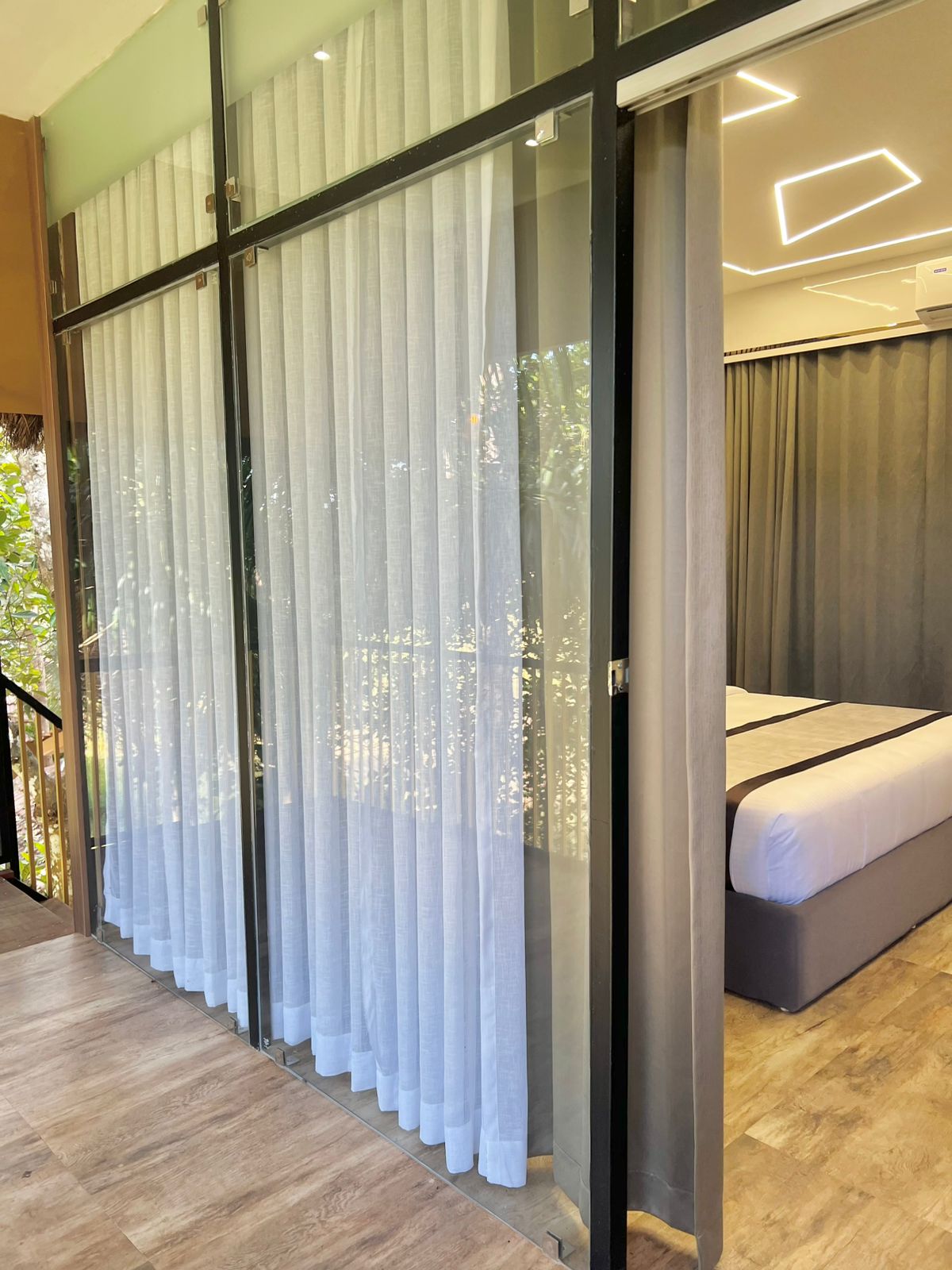 Glass entrance leading to the Tree House balcony